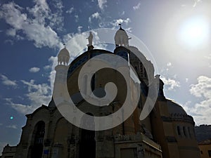 Notre dame d`Afrique Basilica and solar ray through rain drops