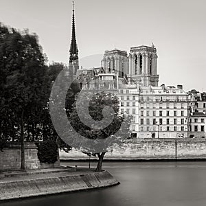Notre Dame de Paris Cathedral towers and Seine River bank