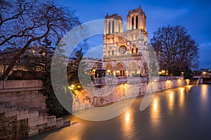 Notre Dame de Paris Catheral at dusk with the overflowing Seine River, Paris, France