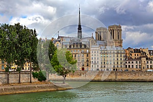 Notre Dame de Paris and parisian buildings. photo