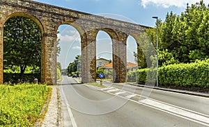 The Nottolini aqueduct crosses a residential road in Lucca Italy