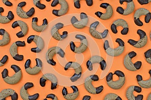 Nougat crescents cookies background on orange