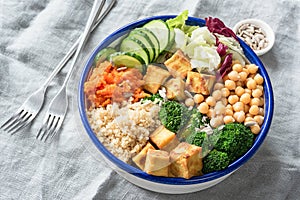 Nourishing buddha bowl with tofu, quinoa and vegetables