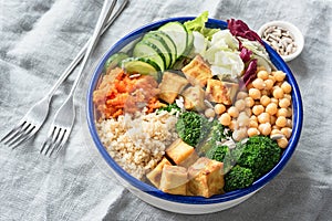 Nourishing buddha bowl with tofu, quinoa and vegetables photo