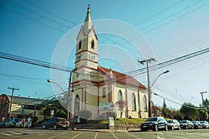 Small church with steeple in a street corner