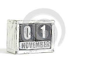 November 01 on wooden calendar, on white background.