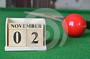 November 02, number cube on snooker table, sport background.