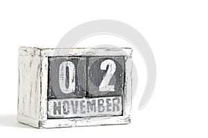 November 02 on wooden calendar, on white background.