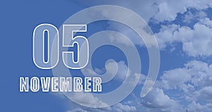 november 05. 05-th day of the month, calendar date.White numbers against a blue sky with clouds. Copy space, autumn
