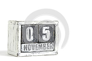 November 05 on wooden calendar, on white background.