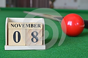 November 08, number cube on snooker table, sport background.