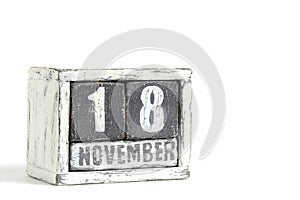 November 18 on wooden calendar, on white background.