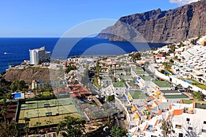 November 19 2021 - Puerto de Santiago, Tenerife, Spain: Coastal town and Gigantes cliffs