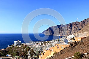 November 19 2021 - Puerto de Santiago, Tenerife, Spain: Coastal town and Gigantes cliffs