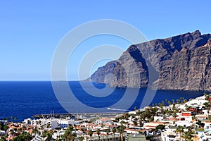 November 19 2021 - Puerto de Santiago, Tenerife, Spain: Coastal town and Gigantes cliffs