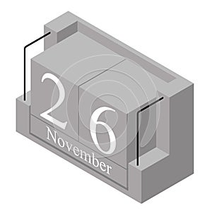 November 26th date on a single day calendar. Gray wood block calendar present date 26 and month November isolated on white