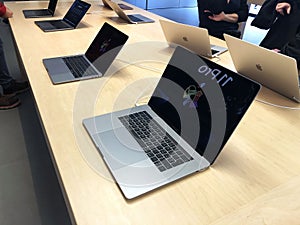 November 2019 Bologna, Italy: Macbooks computers on display in Apple store close-up across shoppers