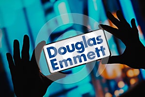 November 29, 2023, Brazil. In this photo illustration, the Douglas Emmett logo is displayed on a smartphone screen