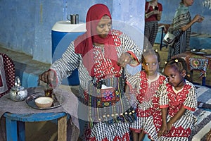 Nubian village shows Moslem mother and child in doorway along Nile River, Egypt