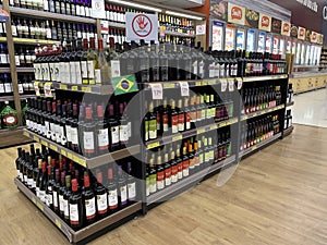 Stock with varieties of Brazilian wines in a supermarket.