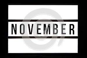 NOVEMBER text in a light box