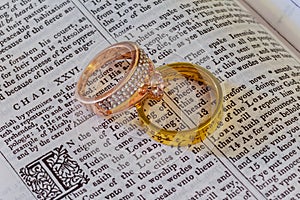 november 04 2016 wedding ring on a bible open to marriage scripture.