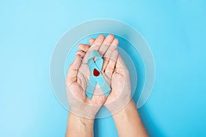 November World Diabetes day Awareness month, Woman holding light Blue Ribbon with blood drop for supporting people living,