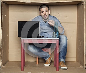 Novice businessman drinking alcohol at work