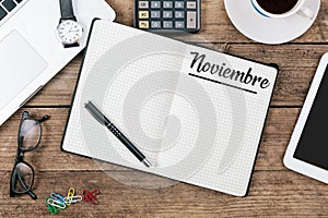 Noviembre Spanish November month name on paper note pad at off