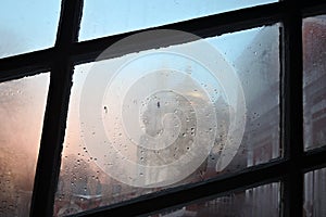Novodevichy convent in Moscow. Window covered by raindrops.