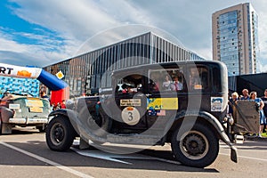 Novokuznetsk, Russia, 13 June 2019: The 7th Peking to Paris Motor Challenge 2019. Ford Model A 1930 leaving the city and going to