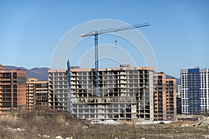 Novorossiysk Two hoisting cranes and buildings under construction photo