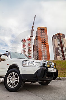 Novosibirsk, Russia - 07.07.20: front view of a Honda CR-V car in a white body of a Japanese crossover with piaa fog lights and a