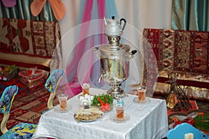 Novruz holiday background . Semeni on vintage plate decorated . Samovar and teapot . Samovar on a background of Novruz holiday . T