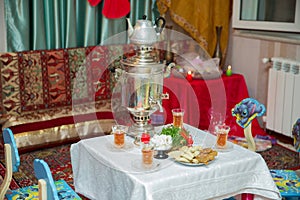 Novruz holiday background . Semeni on vintage plate decorated . Samovar and teapot . Samovar on a background of Novruz holiday . T