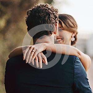 Now Mr and Mrs. Shot of a happy young couple standing together on their wedding day.