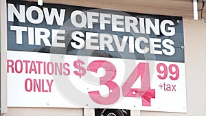 now offering tire services rotations only 3499 35 dollars plus tax sign on wall 154 v