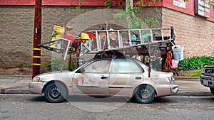 Now that`s a handyman, a dude who put a lumber rack on his little sedan and strapped all his tools and equipment to it.