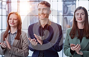 Now thats a standing ovation. Shot of a group of businesspeople applauding during a seminar in the conference room.