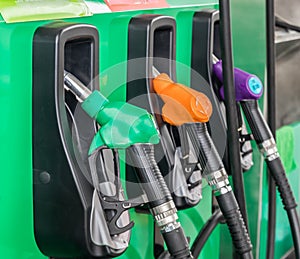 nozzles for fill fuel car. at petrol station