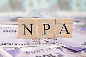 NPA or Non Performing Assets business concept on indian currency notes photo