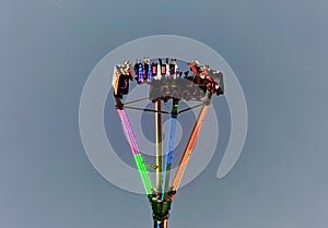 NPE Pleasure and leisure park for children and adults swings and attractions Evening lights on swing Scary creepy swing