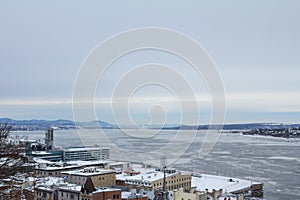 Panorama of frozen Saint Lawrence river fleuve Saint Laurent in Quebec city during a winter afternoon.