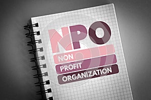 NPO - Non-Profit Organization acronym on notepad, business concept background photo