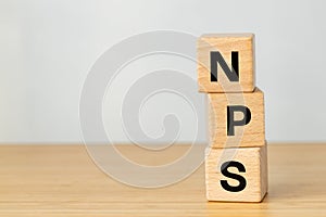 NPS acronym written on wooden blocks, Net Promoter Score, Company customer loyalty assessment tool, Customer satisfaction