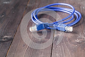 Nternet blue cable on wooden background