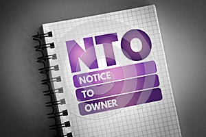 NTO - Notice To Owner acronym on notepad, business concept background photo