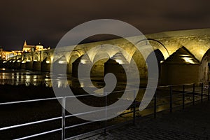 Nubes en movimiento y puente romano photo