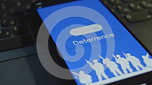 Nuclear Deterrence inscription on smartphone screen with blue background. Graphic presentation with silhouettes of