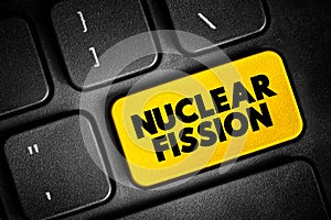 Nuclear Fission - reaction in which the nucleus of an atom splits into two or more smaller nuclei, text concept button on keyboard